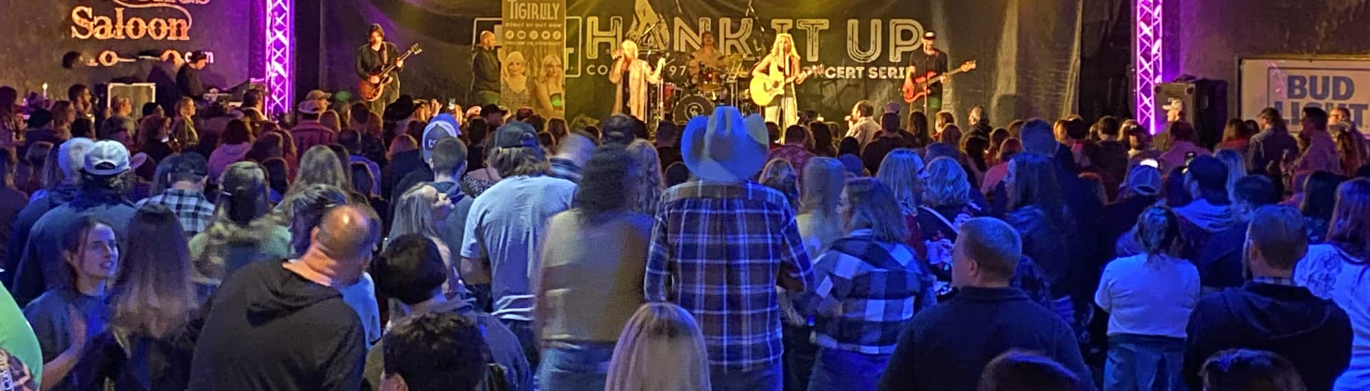 country concert with fans wearing cowboy hats Minneapolis